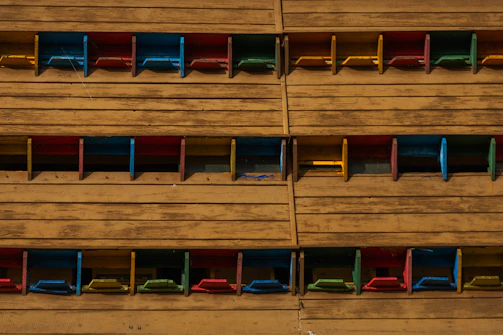 Public space seating area featuring colorful, hand-painted wooden furniture.