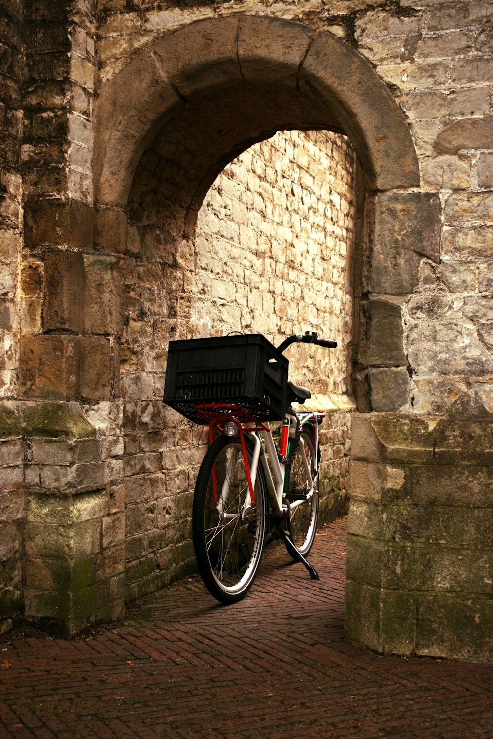 a bike is parked in a stone tunnel