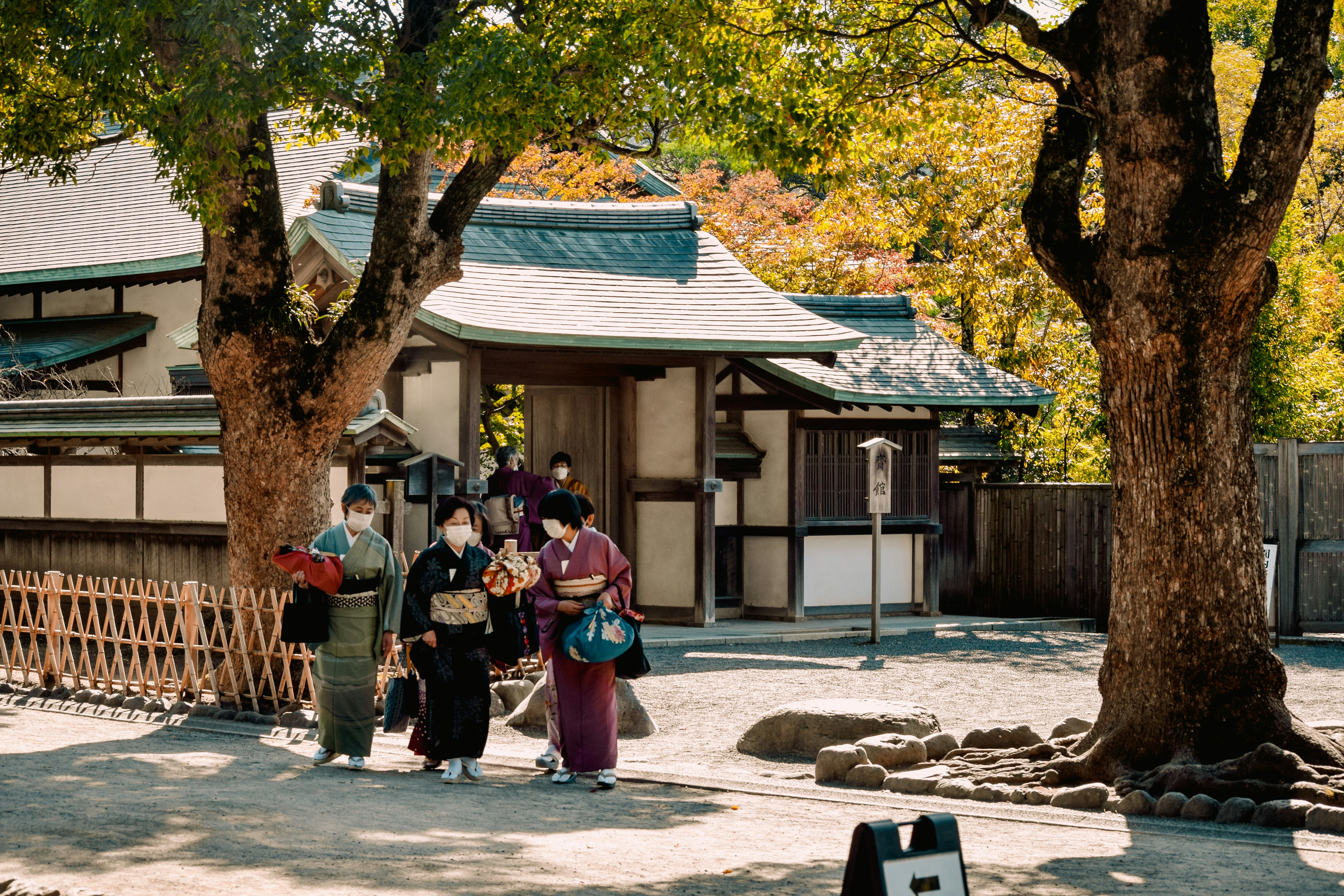 a group of people standing in front of a building