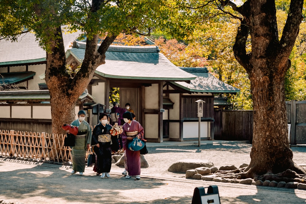 a group of people standing in front of a building