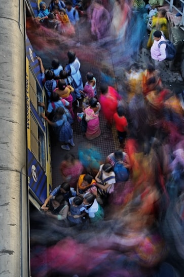 A vibrant photo of travelers boarding the Regiotram train in Bogotá, bags in hand, ready for adventure.
