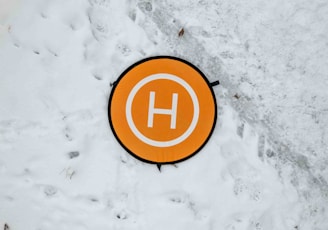 a sign that is on the ground in the snow