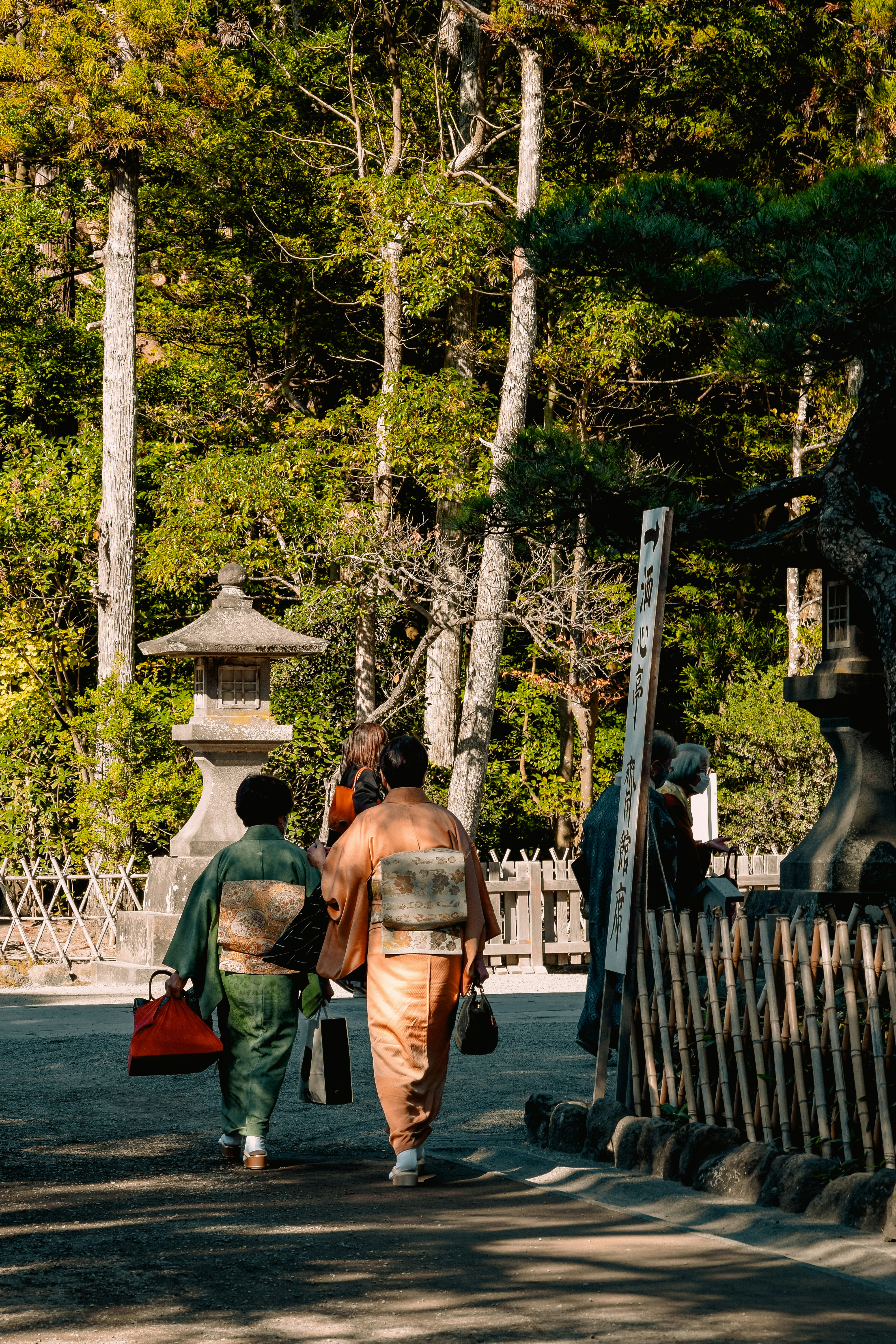 a couple of people walking down a street