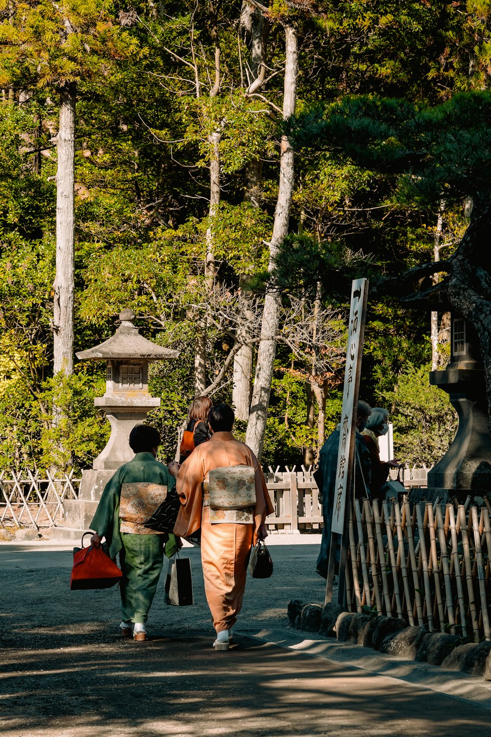 a couple of people walking down a street