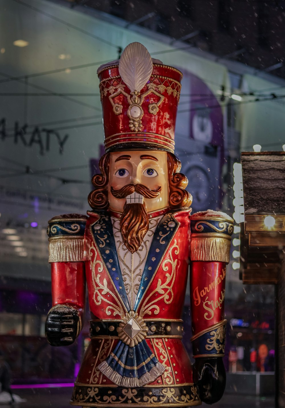 a statue of a nutcracker in a store window