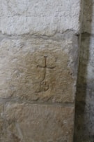 A symbolic emblem representing the secret society, carved into stone.