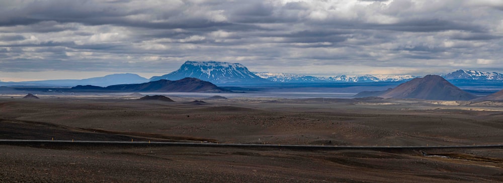 a view of a mountain range with mountains in the background