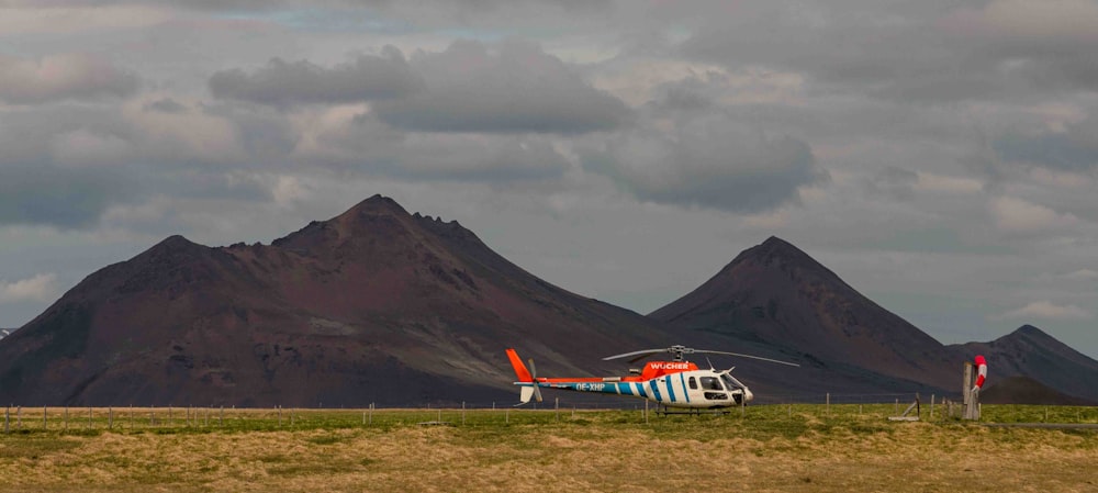 a helicopter that is sitting in the grass