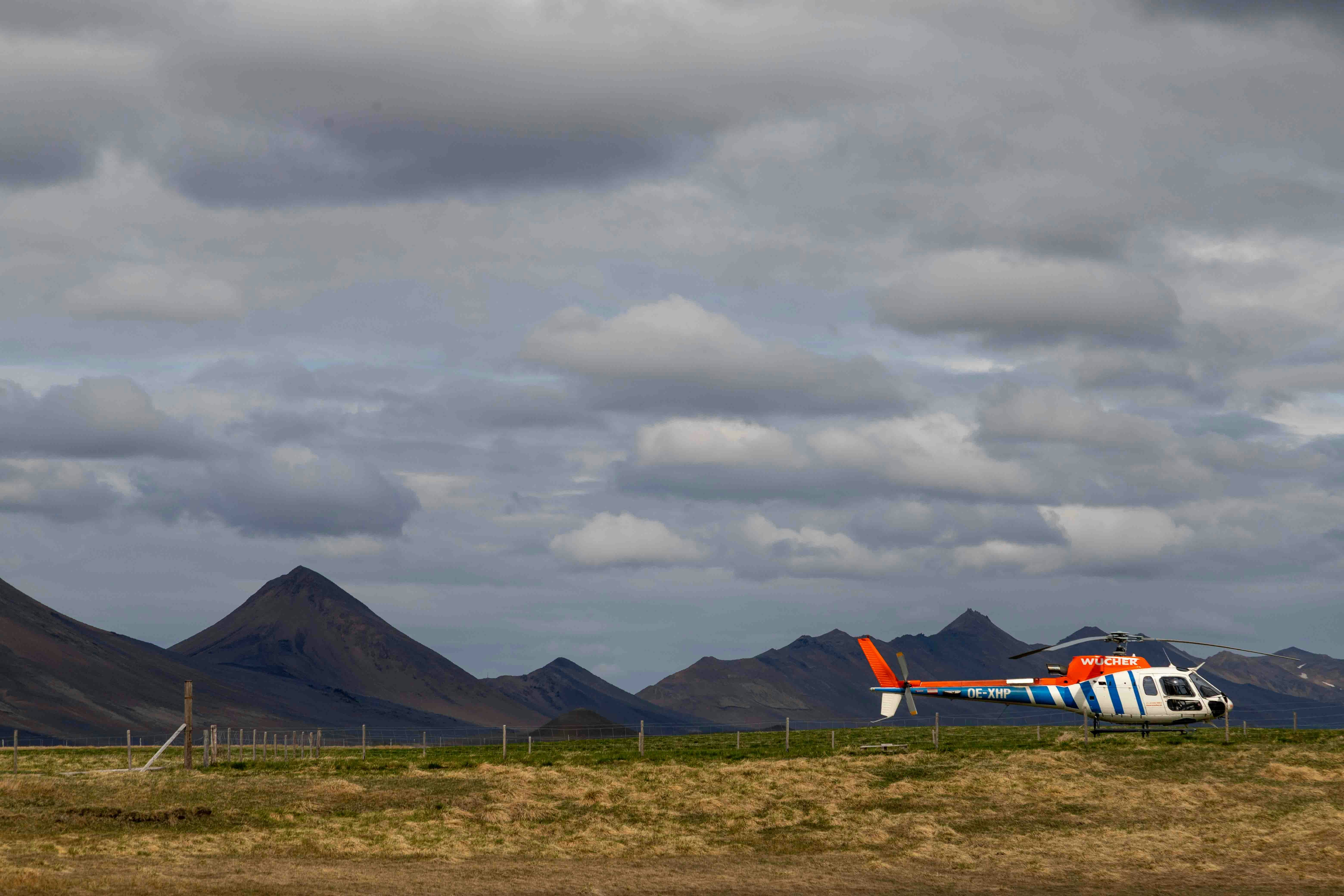 a small plane is parked on a grassy field