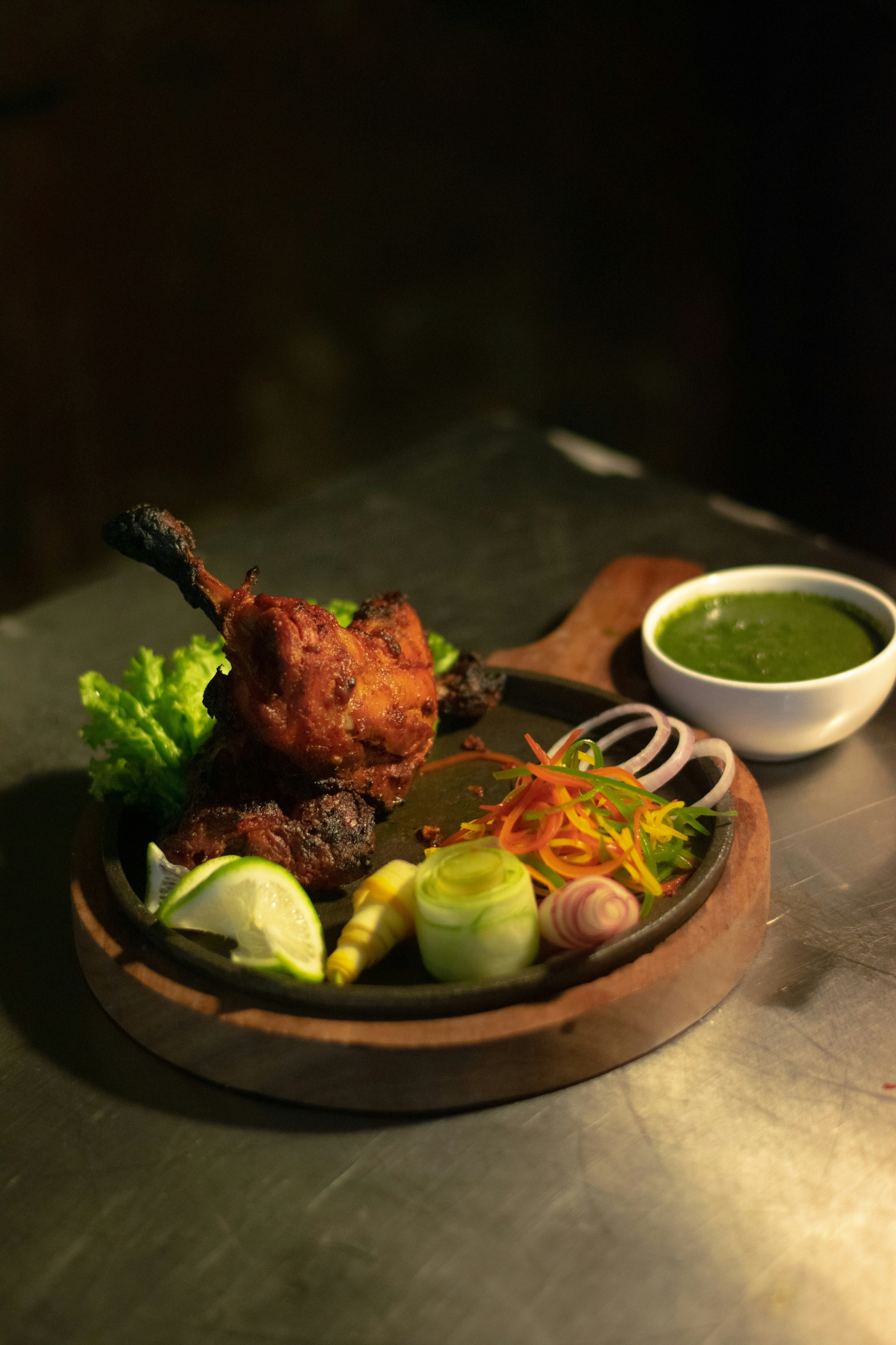 a plate of food on a table with dipping sauce