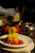 Elegant plated gourmet French dish with vibrant Mediterranean colors, served in a cozy home setting.