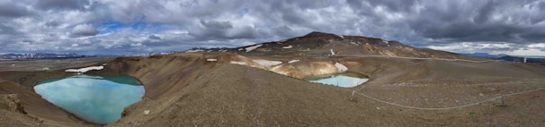 A panoramic view of bentonite mines nestled in the rugged Turkish landscape under a clear sky.