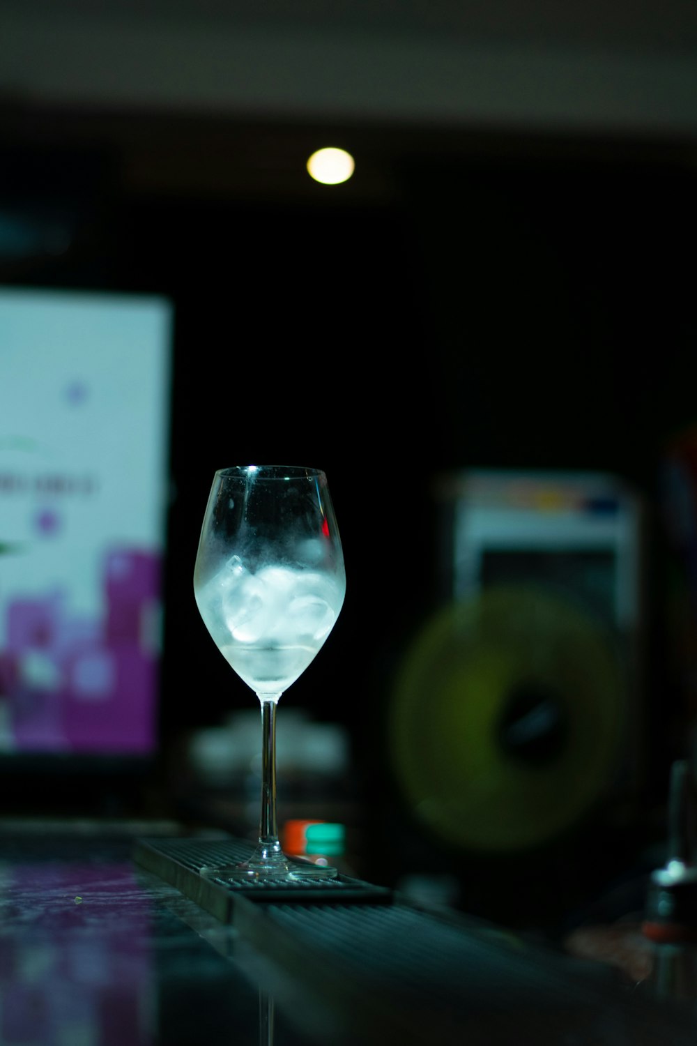 a wine glass sitting on top of a table