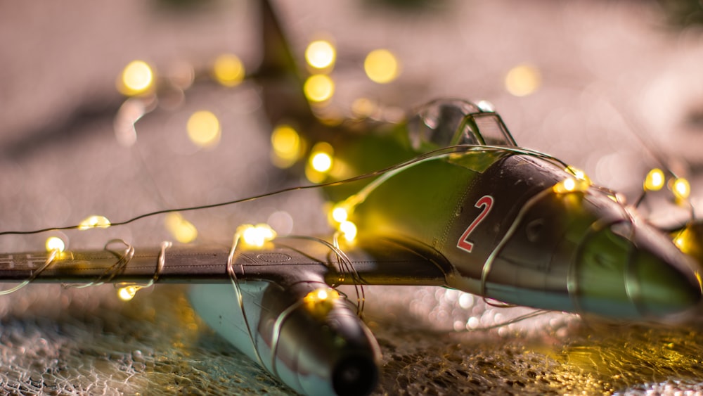a toy airplane with a string of lights around it