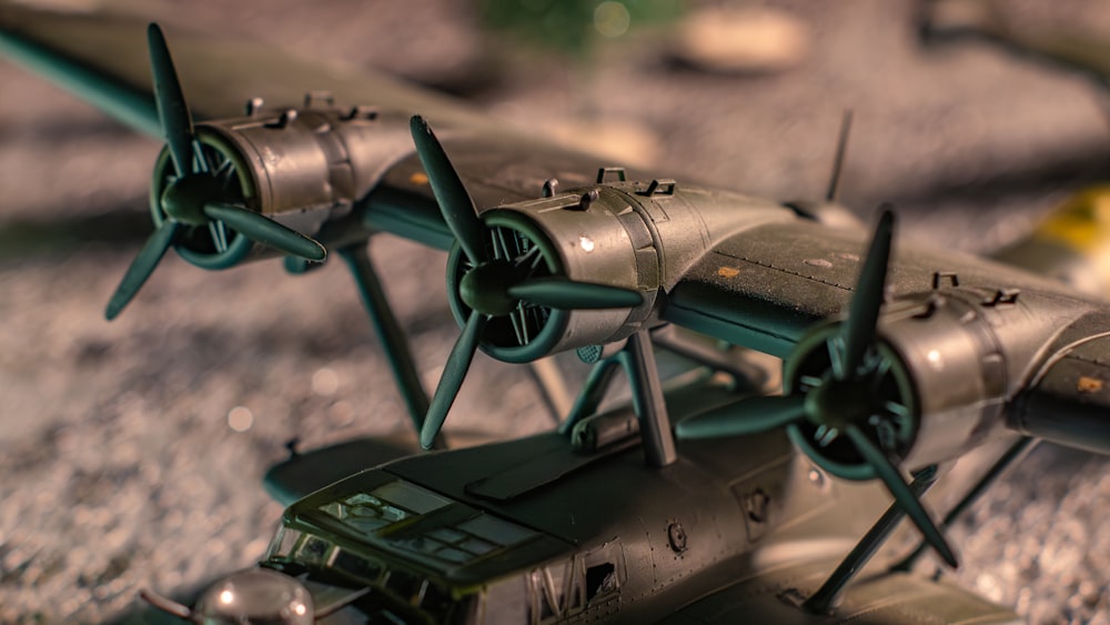 two model airplanes sitting on top of a table