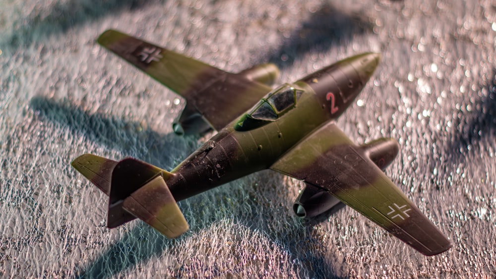 a toy model of a fighter jet on a table