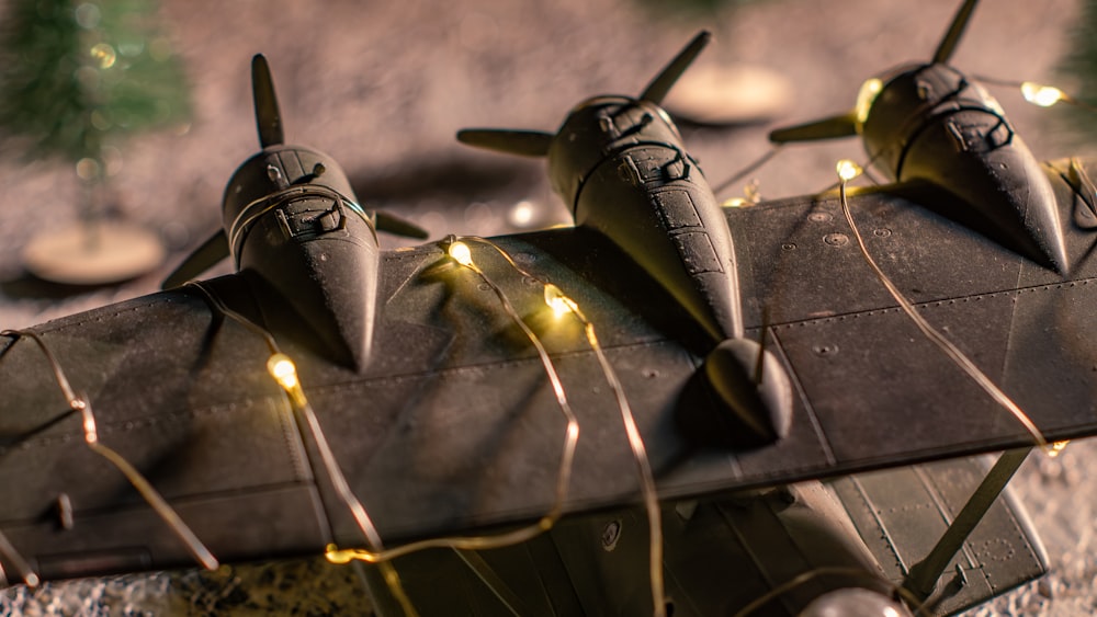 a model airplane with lights on it sitting on the ground