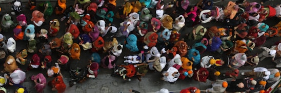 A vibrant collage showing Bangladeshi people in traditional dress, bustling city scenes, and cultural festivals across the globe.