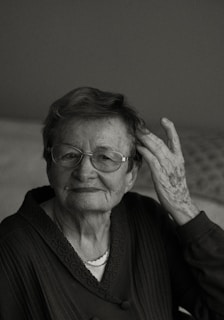 a black and white photo of an elderly woman