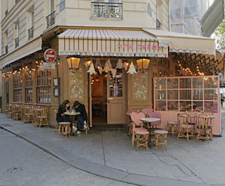 A charming street café with outdoor seating, where travelers share stories over coffee.
