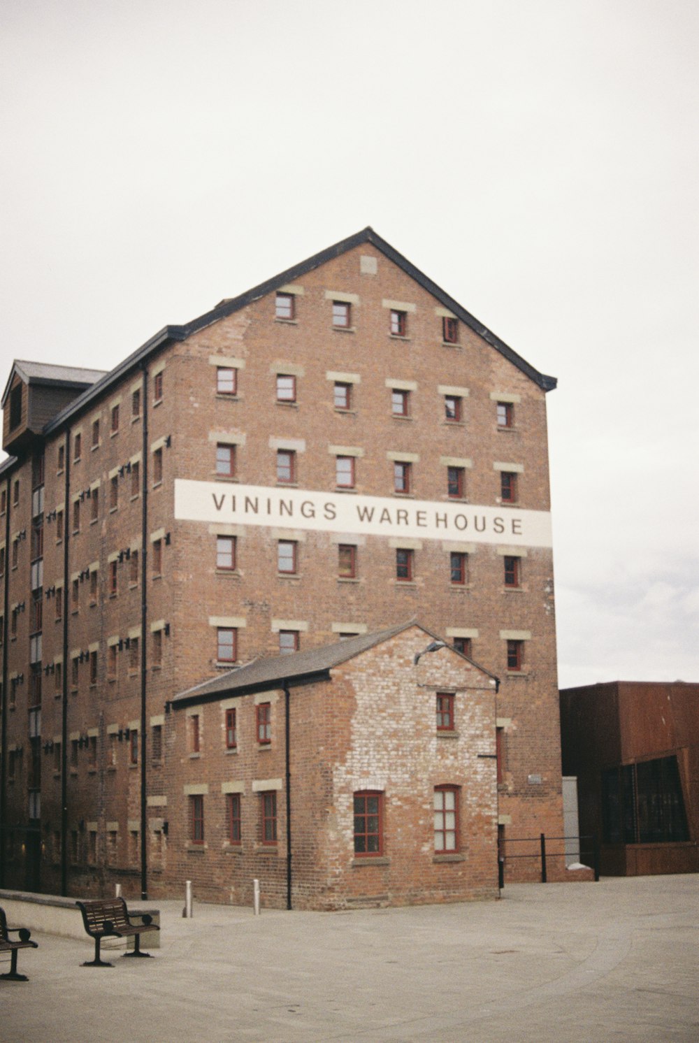 a large brick building with a sign on the side of it