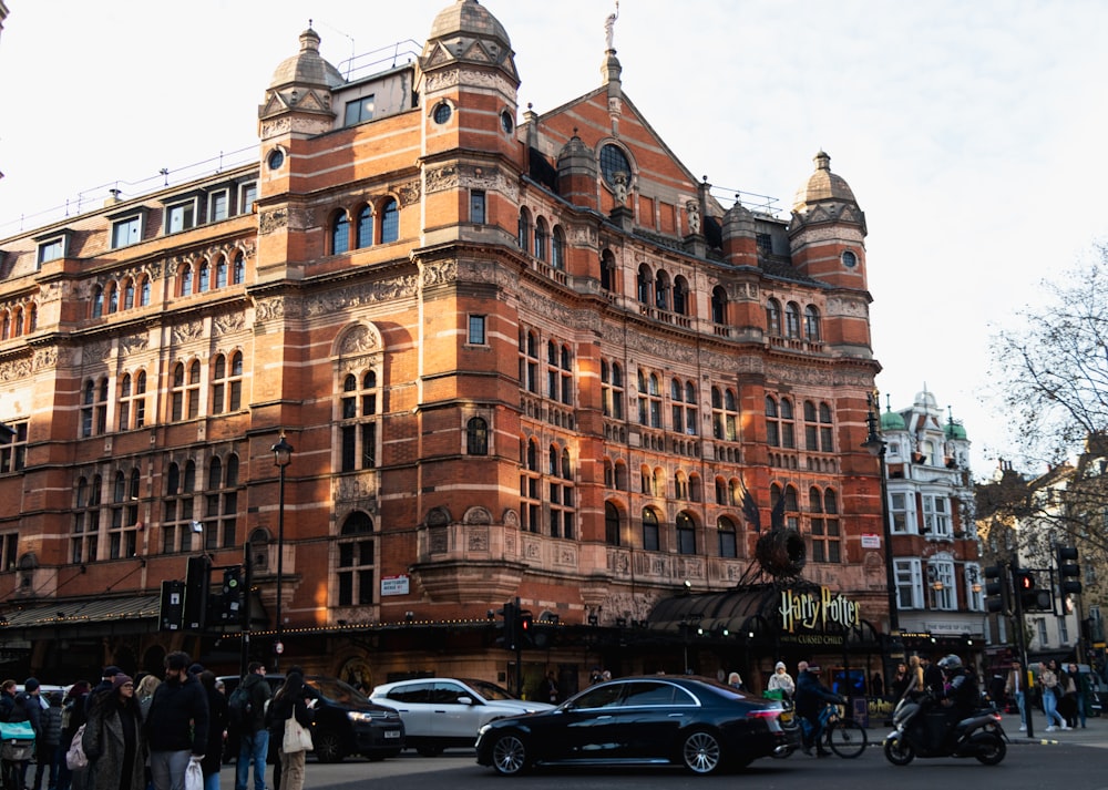 a large building with a lot of people standing around it