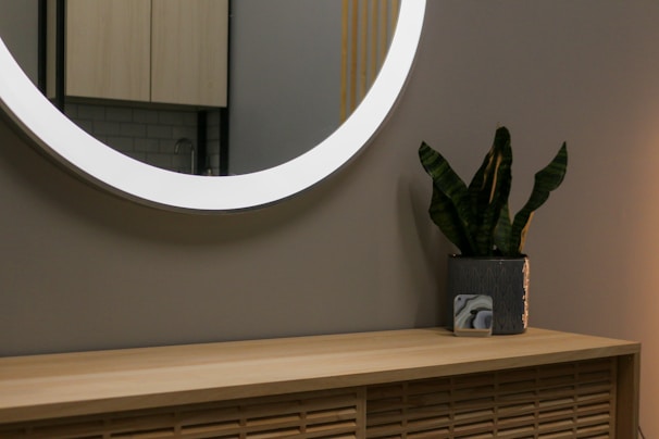 A modern bathroom vanity with stylish fixtures and a large mirror reflecting natural light.
