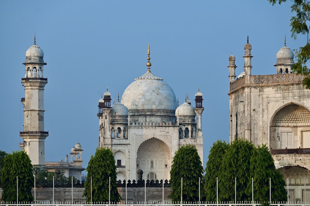 a large white building with two towers on top of it