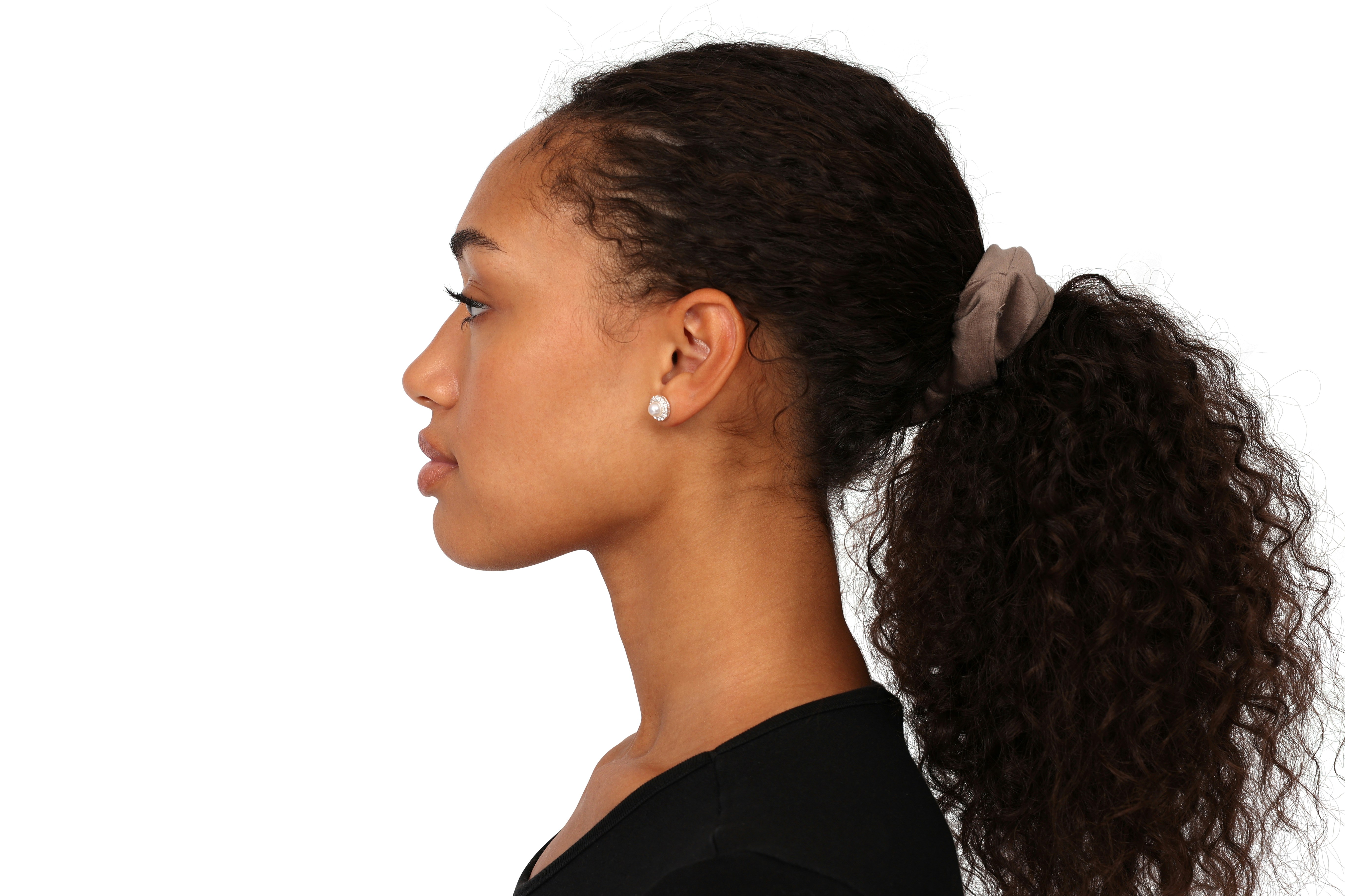 a woman with a ponytail in her hair