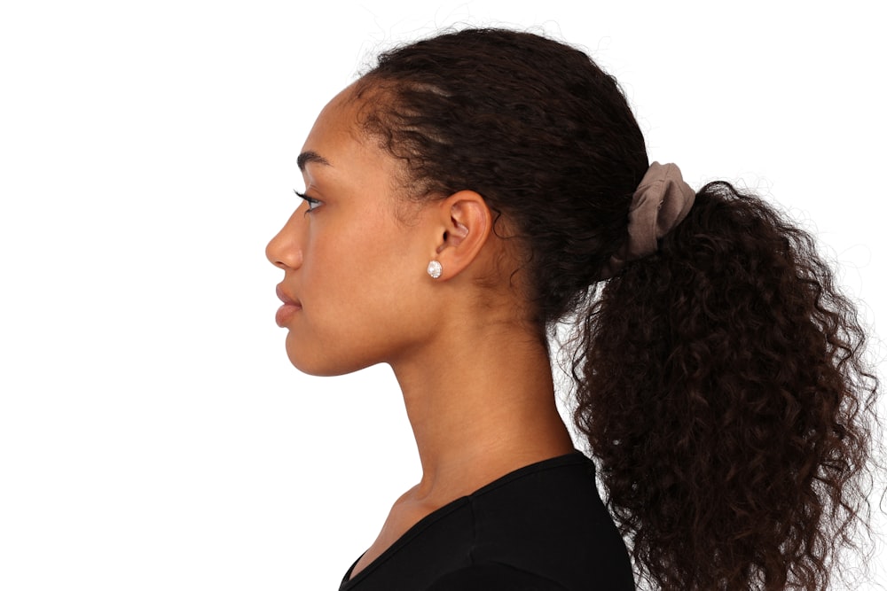 a woman with a ponytail in her hair