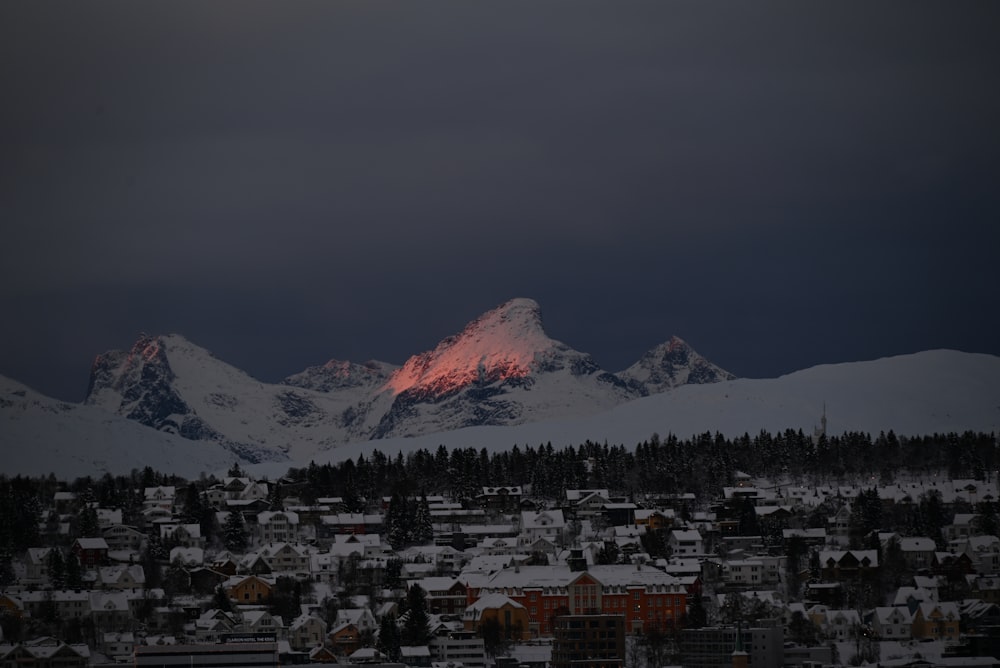 a snow covered mountain range in the distance