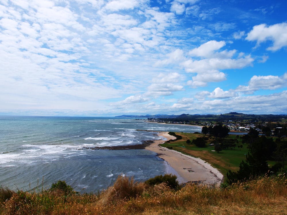 a scenic view of a beach and the ocean