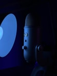 a microphone and a light in a dark room