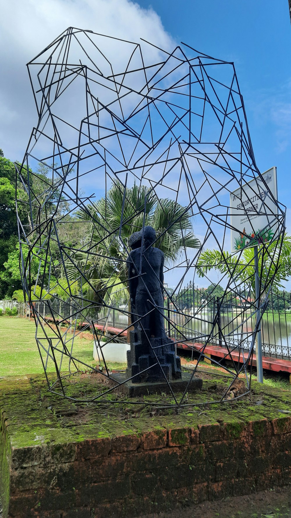 a sculpture in the middle of a park
