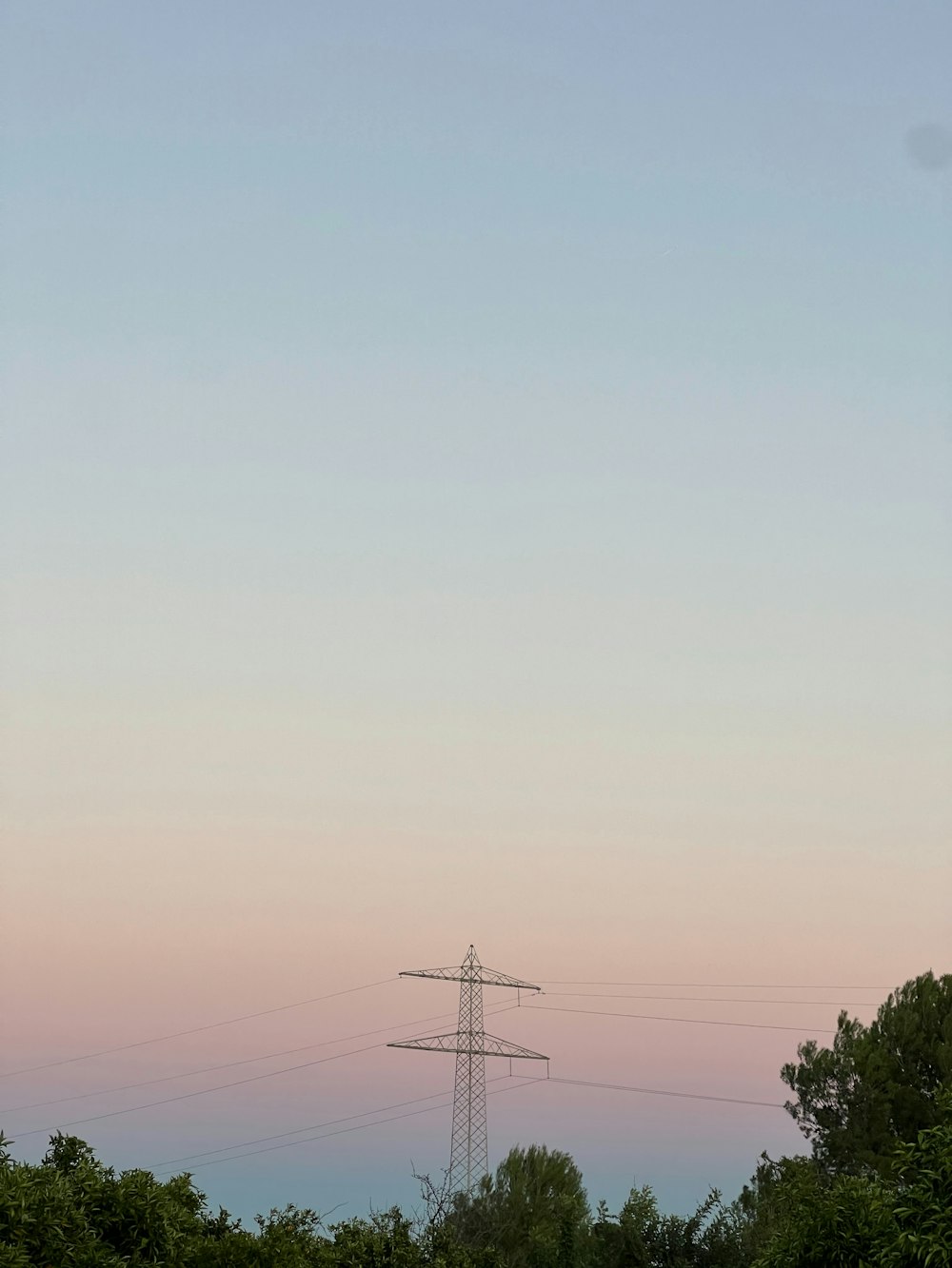 a telephone pole in the middle of a field