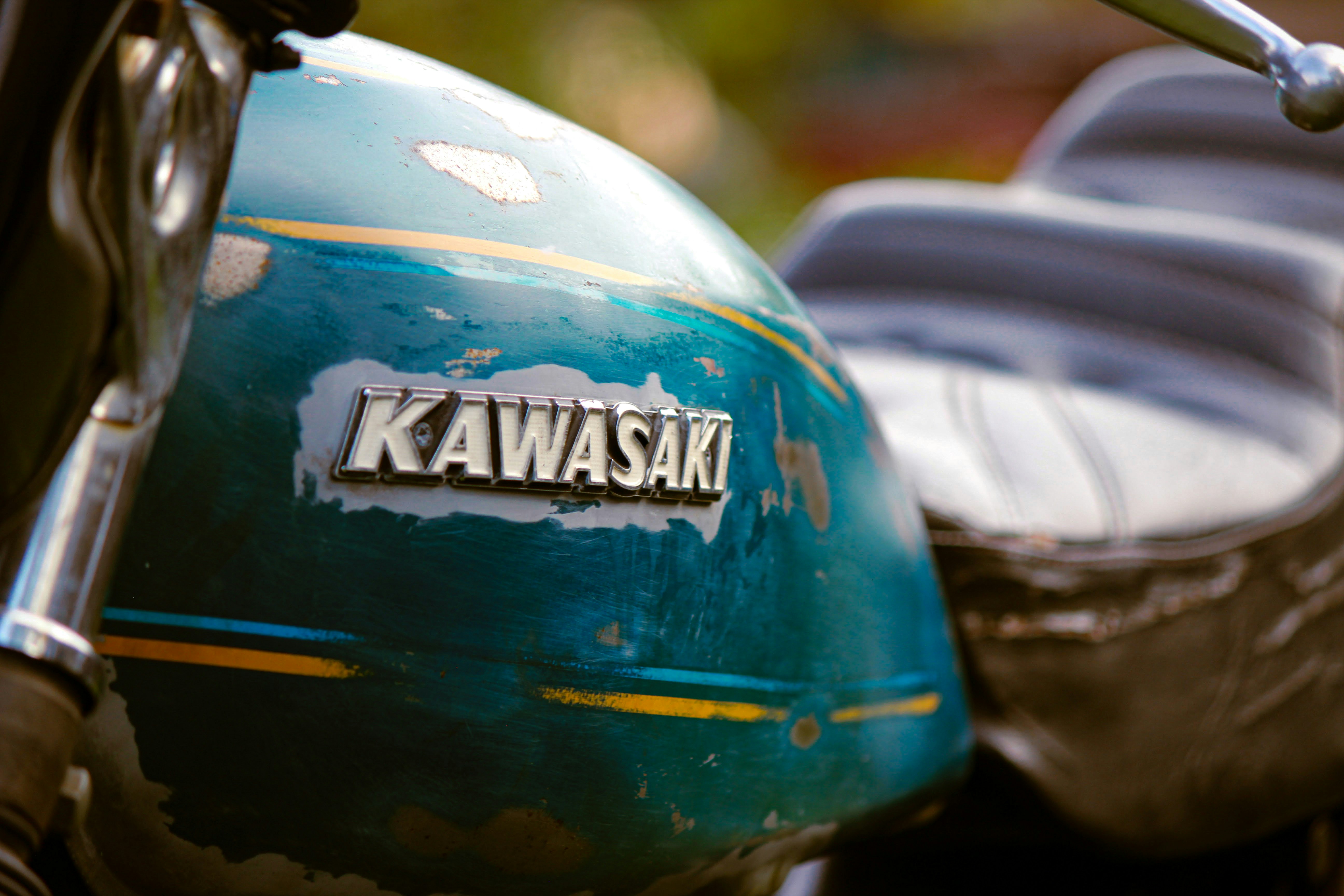 a close up of a kawasaki motorcycle with the name kawasaki on it