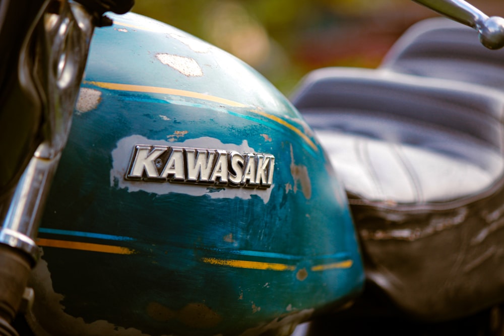 a close up of a kawasaki motorcycle with the name kawasaki on it