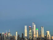 Modern city skyline at dusk reflecting premium real estate investment opportunities.