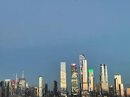 Modern city skyline at dusk reflecting premium real estate investment opportunities.