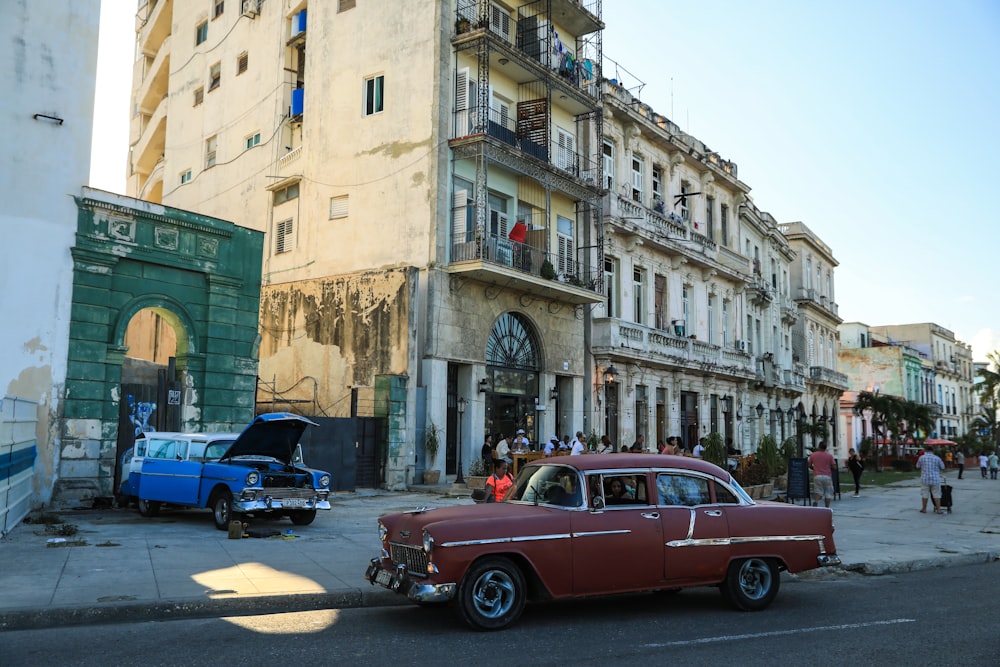 an old car parked on the side of the road