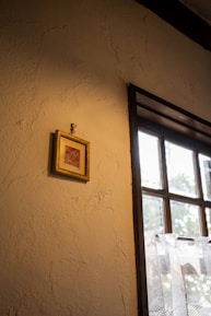 Close-up of a framed photo of a beloved family member with soft natural light.