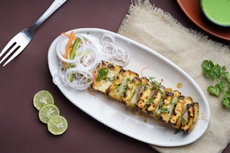 a white plate topped with food next to a fork