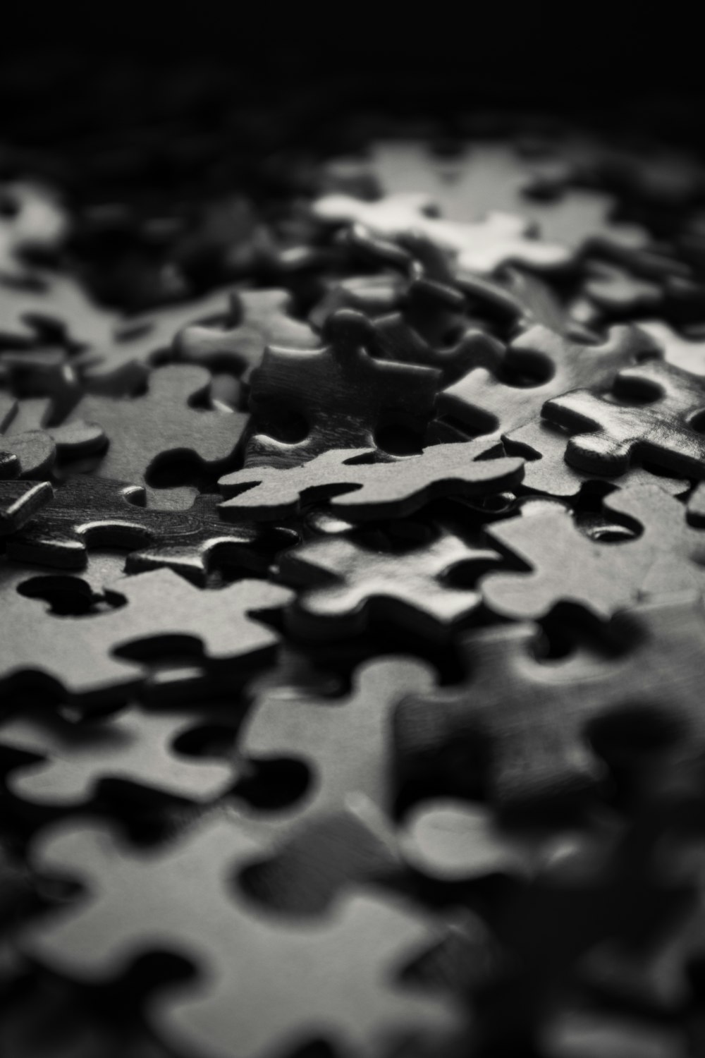 a black and white photo of a puzzle piece