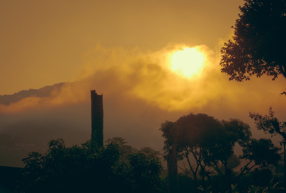 the sun is shining through the clouds in the sky