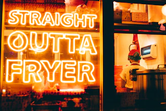 a neon sign that reads straight outa fryer