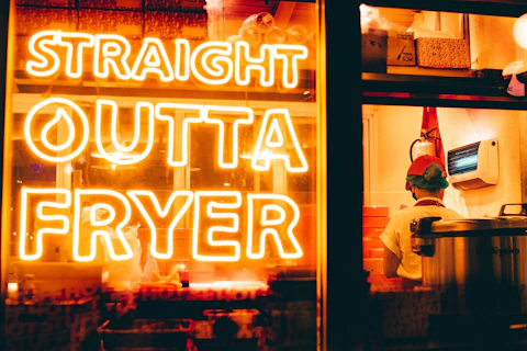 a neon sign that reads straight outa fryer