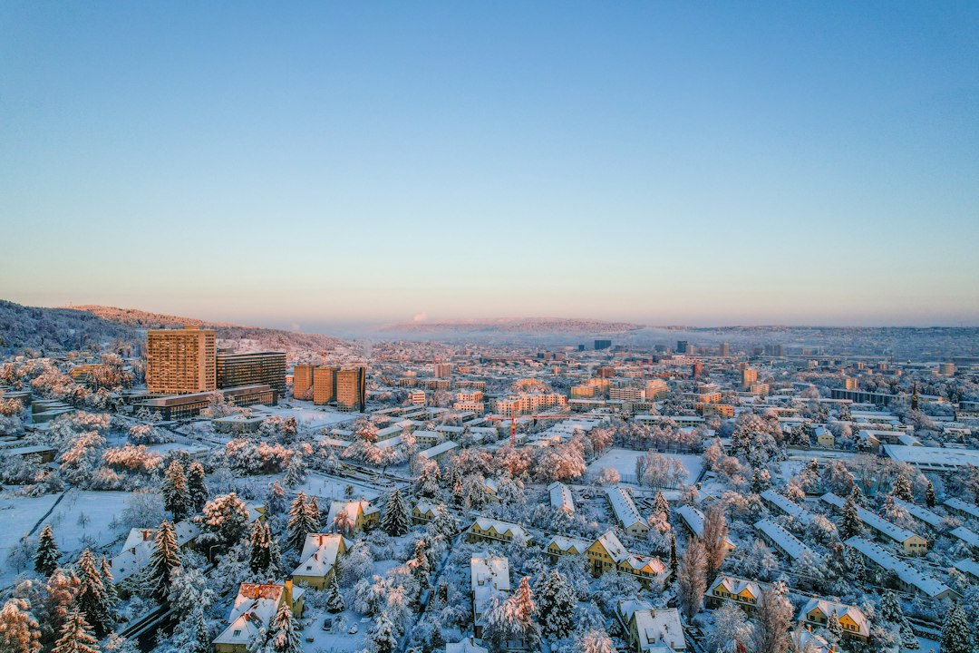 an aerial view of a city in winter,