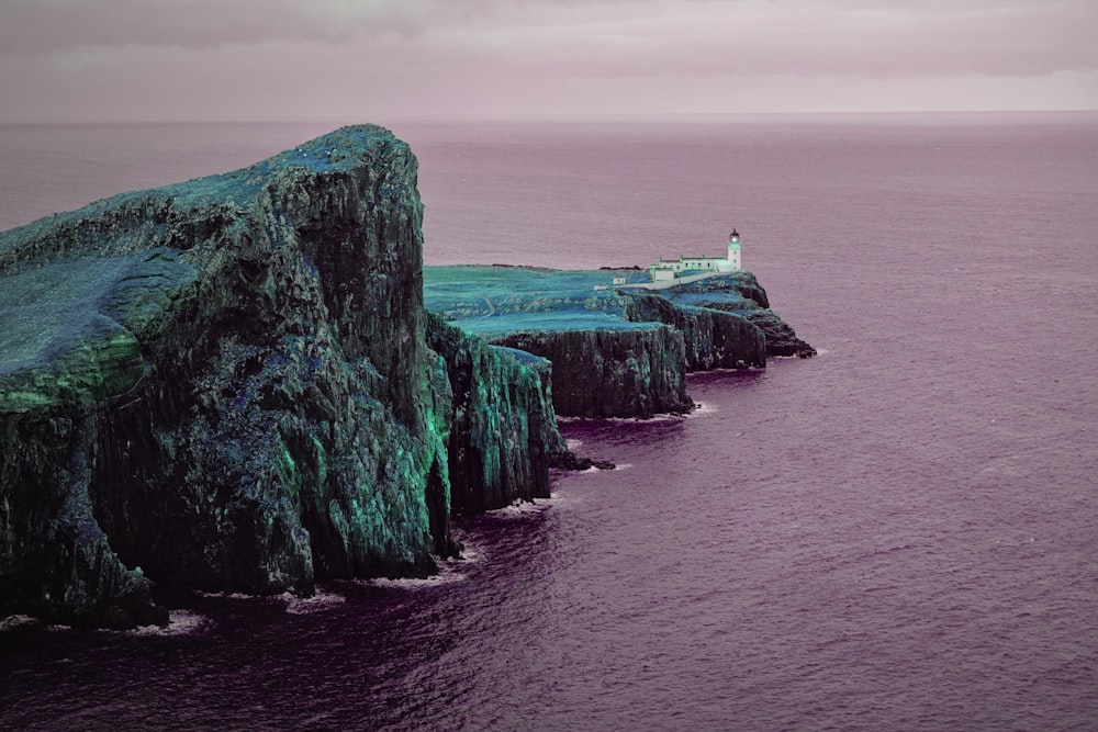 an island with a lighthouse on top of it