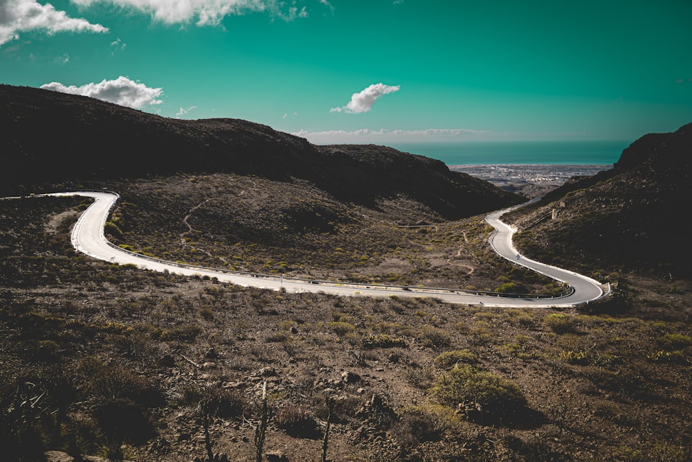 a winding road in the middle of a desert