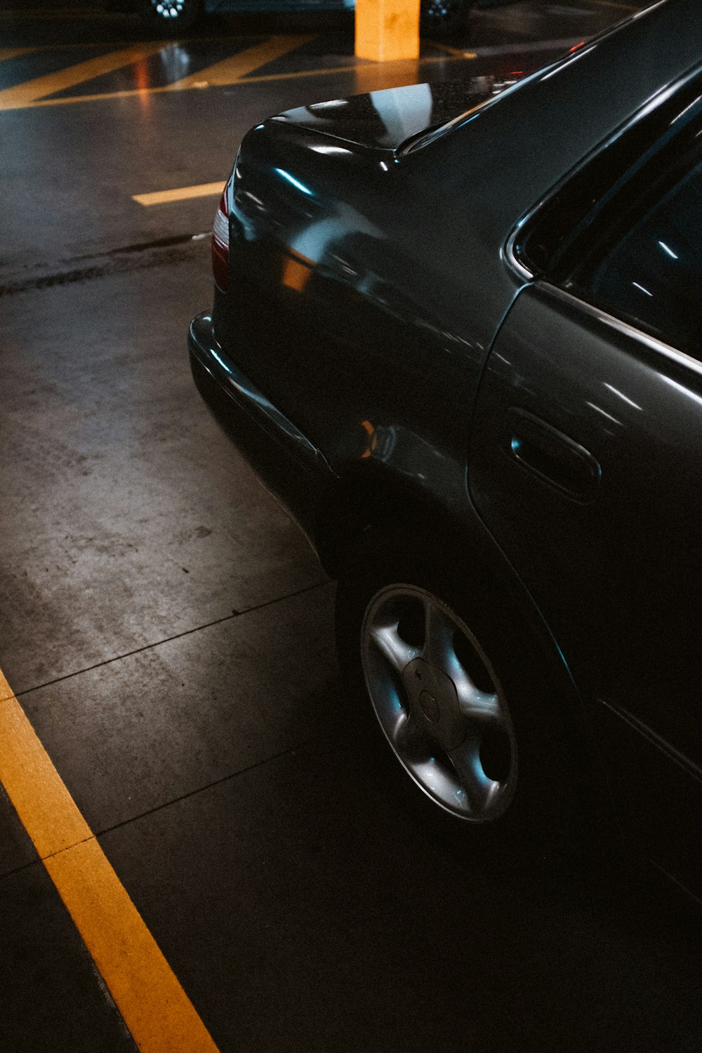 a car parked in a parking lot at night